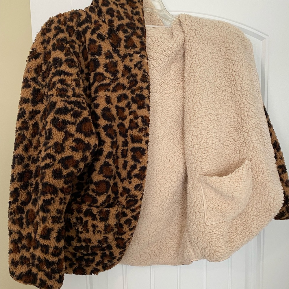 Fuzzy coat- never worn. Reversible cheetah